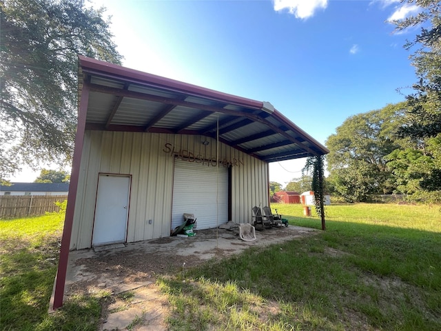 garage featuring a lawn