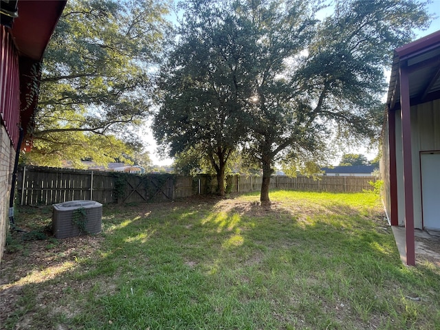 view of yard with central AC