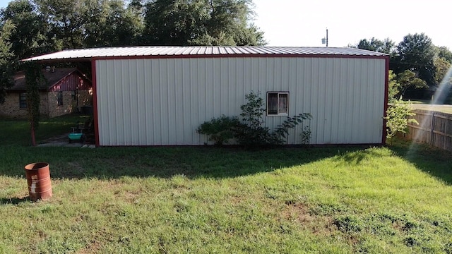 view of outbuilding with a lawn