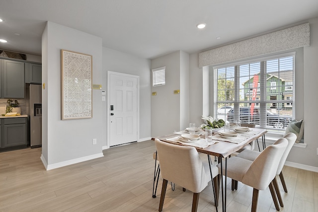 dining space with light wood-type flooring