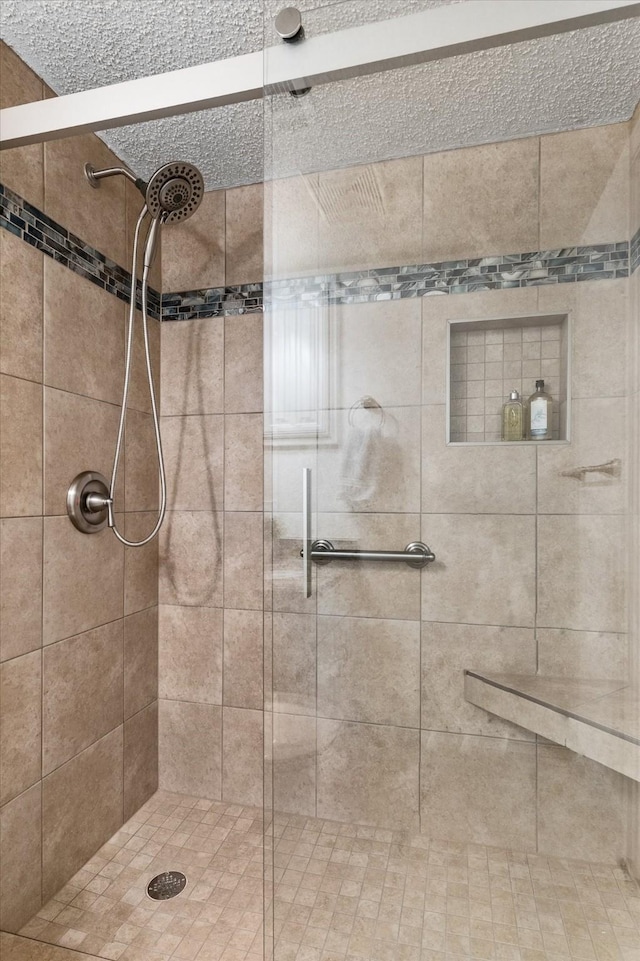 bathroom with tiled shower