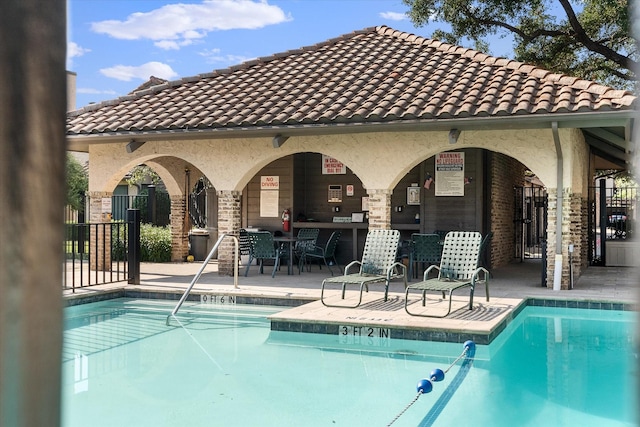 view of pool featuring a patio