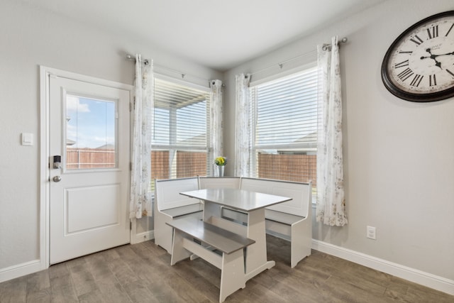 kitchen featuring a kitchen island, hanging light fixtures, hardwood / wood-style floors, and stainless steel appliances