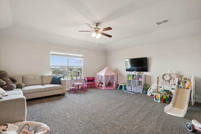 playroom featuring carpet, ceiling fan, and vaulted ceiling