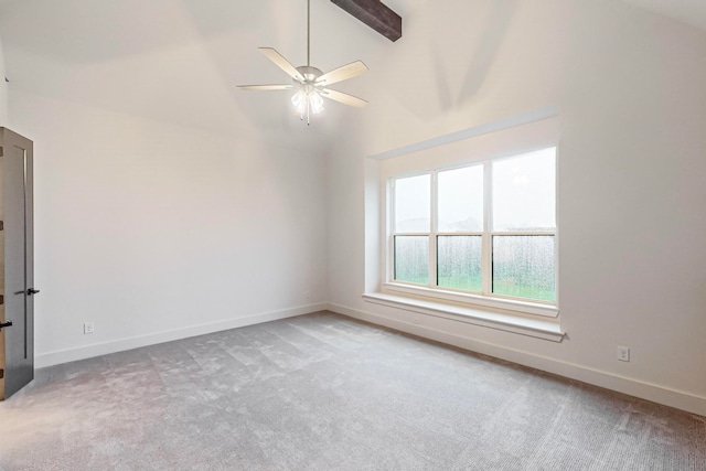 spare room featuring ceiling fan, light colored carpet, and high vaulted ceiling