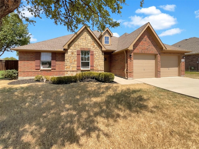 view of front of house with a garage, concrete driveway, brick siding, and a front lawn