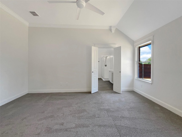 unfurnished bedroom with carpet floors, visible vents, vaulted ceiling, and baseboards