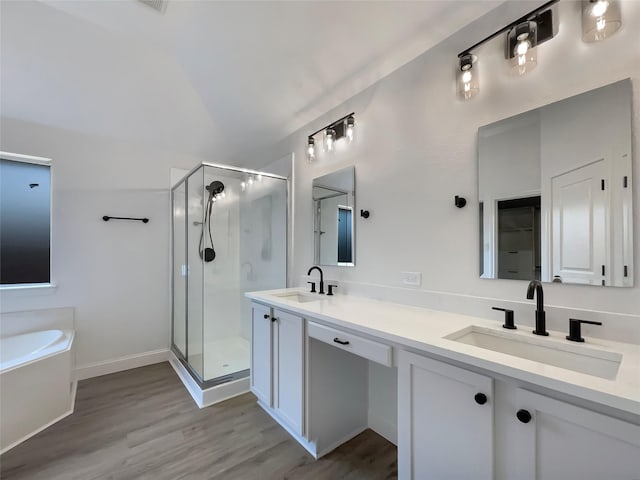 full bath featuring a sink, a shower stall, and a bath