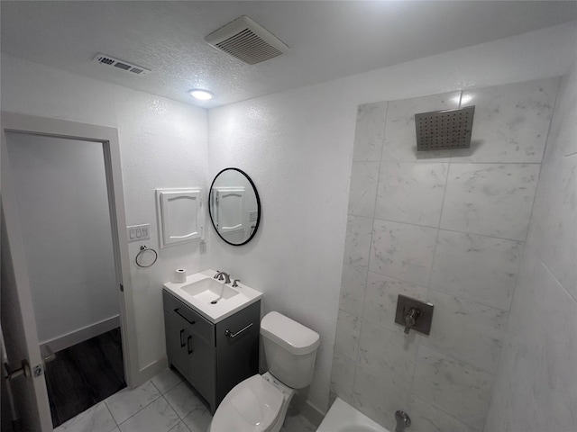 full bathroom featuring vanity, a textured ceiling, toilet, and separate shower and tub