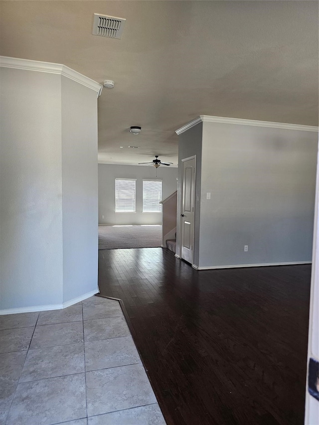 interior space featuring ornamental molding and hardwood / wood-style flooring