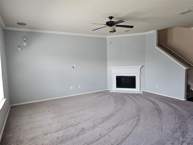 unfurnished living room with carpet floors, ornamental molding, and ceiling fan