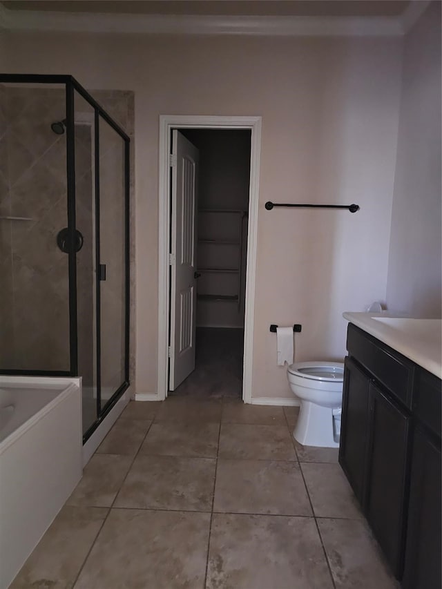 full bathroom with vanity, shower with separate bathtub, toilet, and tile patterned flooring