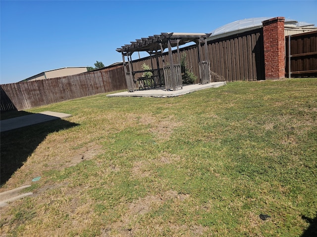 view of yard with a pergola and a patio area