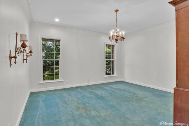 carpeted spare room featuring ornamental molding and a chandelier