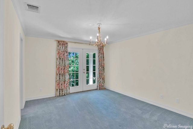 carpeted empty room featuring ornamental molding, an inviting chandelier, and french doors