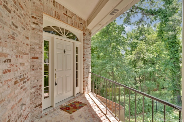 doorway to property featuring a balcony