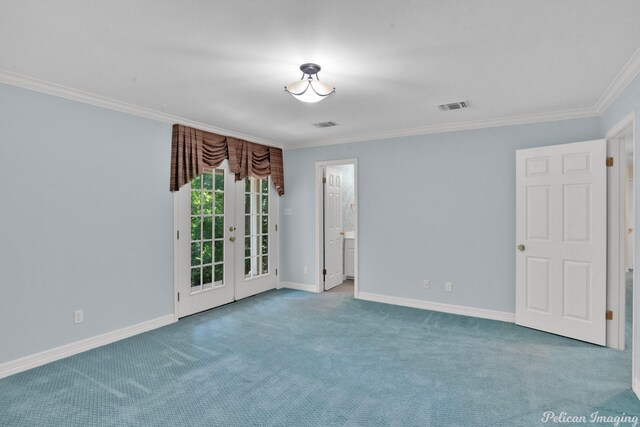 unfurnished room featuring crown molding, french doors, and carpet