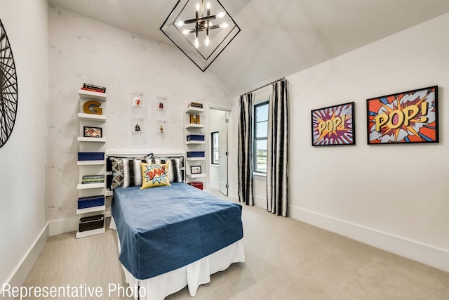 carpeted bedroom with a chandelier and vaulted ceiling