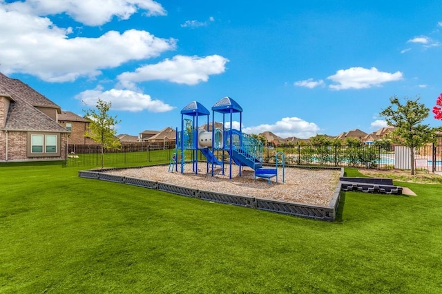 view of playground with a yard