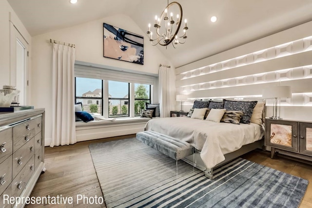 bedroom featuring a notable chandelier, dark hardwood / wood-style flooring, and vaulted ceiling