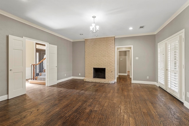 unfurnished living room with crown molding, dark hardwood / wood-style flooring, a brick fireplace, and brick wall