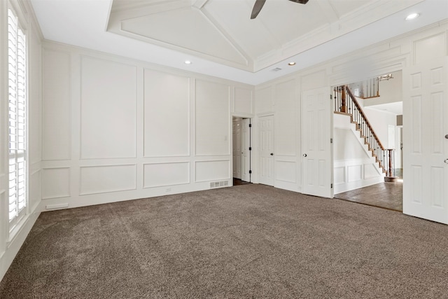 unfurnished room with vaulted ceiling, ceiling fan, and carpet flooring