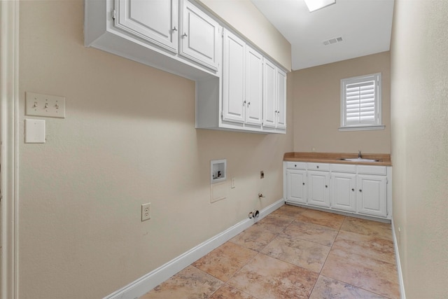 laundry area with cabinets, electric dryer hookup, sink, light tile patterned flooring, and hookup for a gas dryer