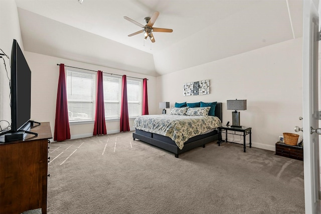 carpeted bedroom featuring ceiling fan and vaulted ceiling