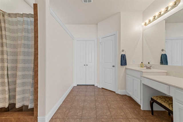 bathroom with tile patterned flooring, vanity, and a shower with shower curtain