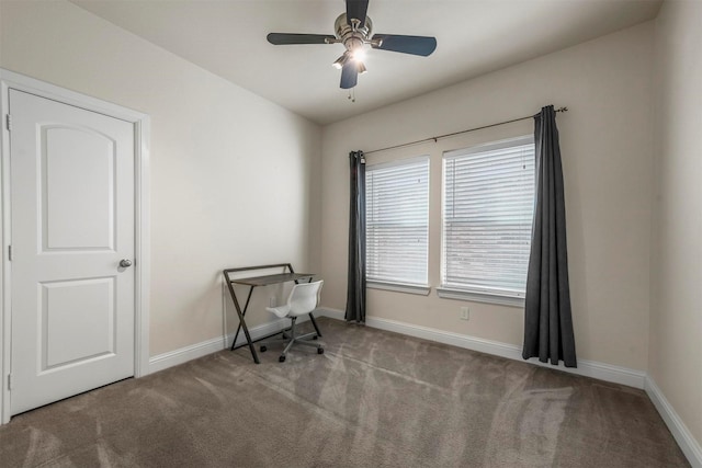 office featuring ceiling fan and light colored carpet