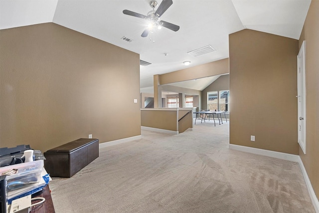 interior space with ceiling fan and vaulted ceiling