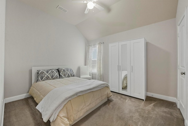 bedroom featuring carpet flooring, a closet, ceiling fan, and lofted ceiling