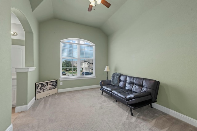 sitting room with light carpet, ceiling fan, and vaulted ceiling