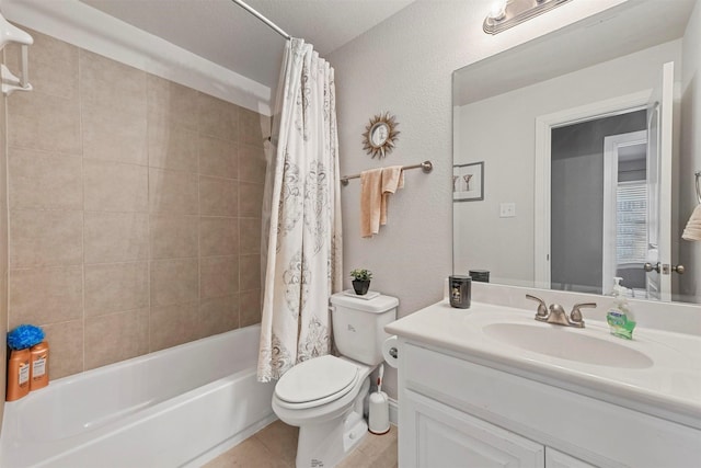 full bathroom with tile patterned floors, a textured ceiling, vanity, shower / tub combo with curtain, and toilet