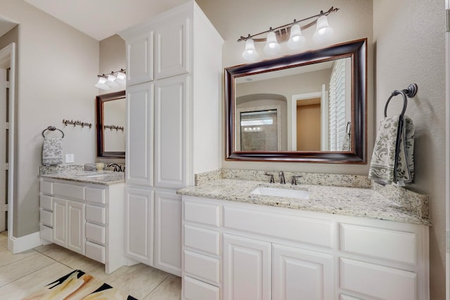 bathroom with vanity and tile patterned flooring