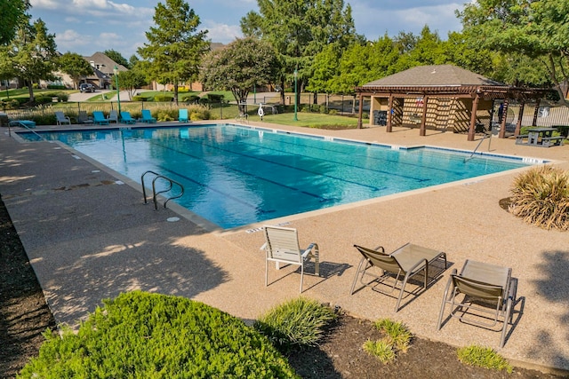 view of pool with a patio area and a gazebo