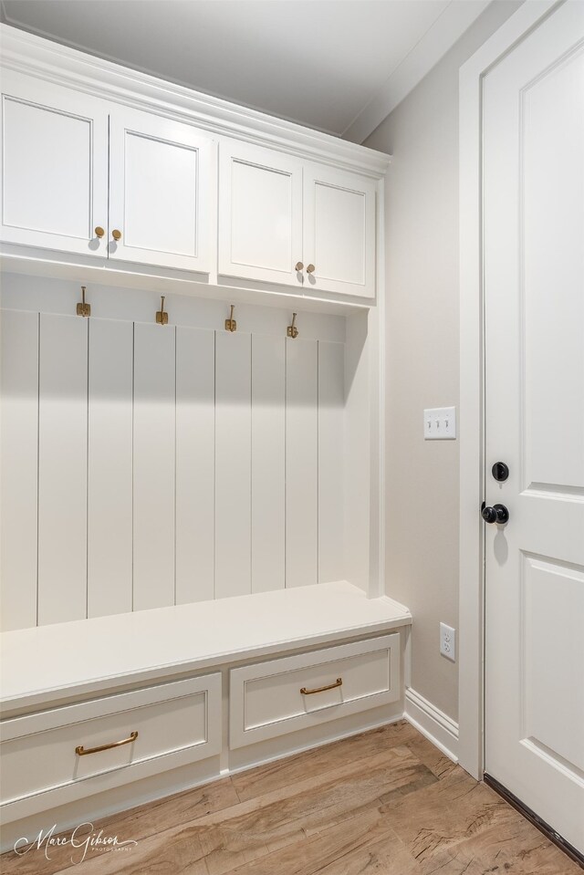 mudroom with light wood finished floors