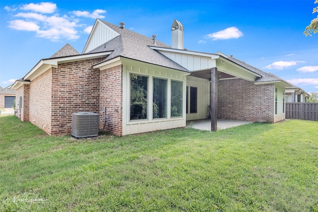 back of property featuring a patio, central AC unit, board and batten siding, and a lawn