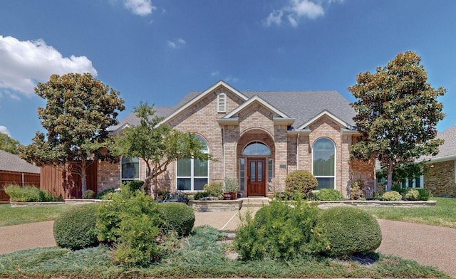 view of front of home with brick siding