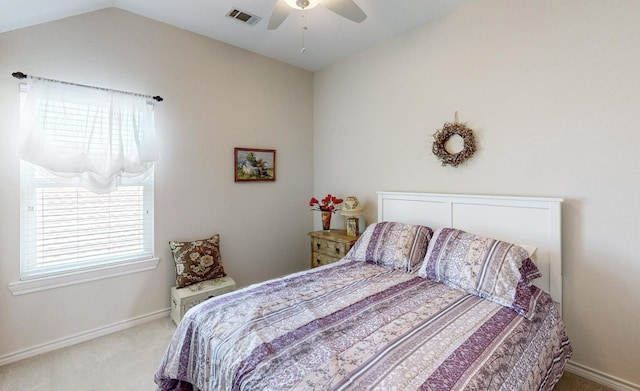 bedroom with carpet flooring, ceiling fan, and vaulted ceiling