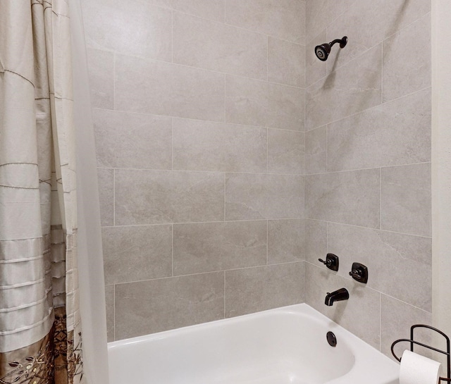 bathroom with shower / tub combo with curtain