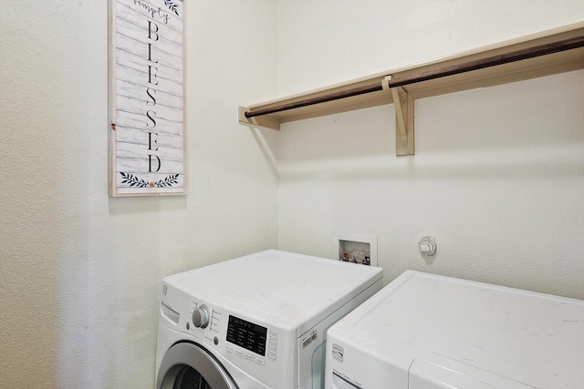 laundry room featuring washer and clothes dryer