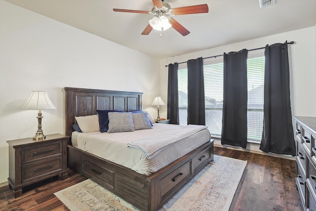 bedroom featuring dark wood-type flooring and ceiling fan