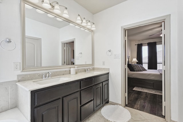 bathroom with vanity, ceiling fan, and hardwood / wood-style flooring