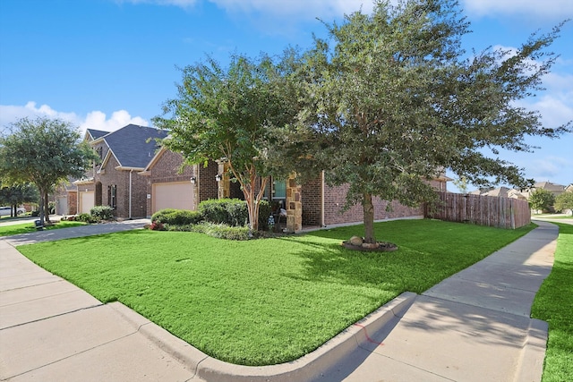 obstructed view of property with a front lawn and a garage