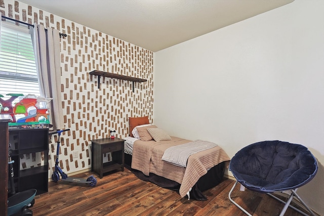 bedroom with dark wood-type flooring