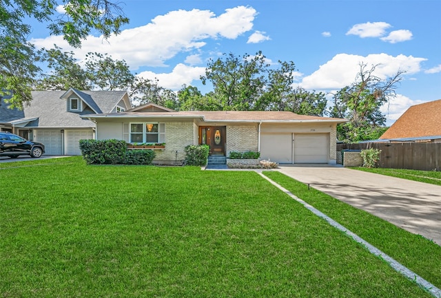 single story home with a garage and a front yard