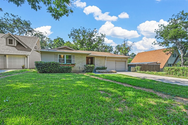 view of front of house featuring a garage and a front lawn