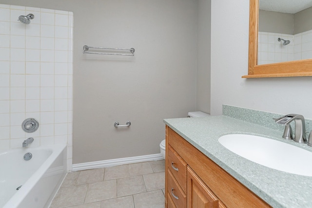 full bathroom featuring vanity, toilet, tile patterned floors, and tiled shower / bath