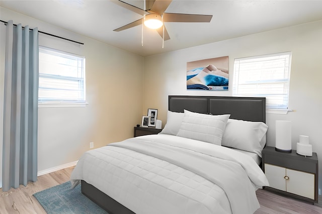 bedroom featuring ceiling fan and light hardwood / wood-style flooring